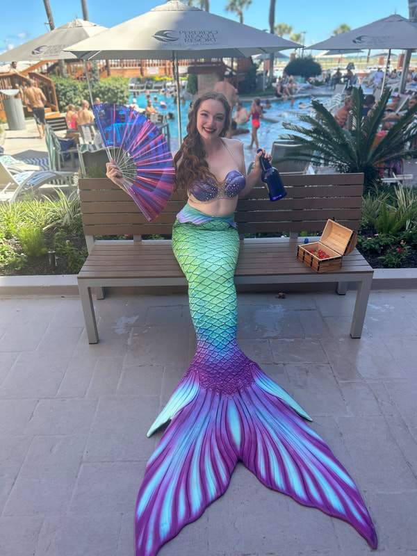 Perdido Beach. Entertainment party company mermaid for booking. Pensacola beach mermaid. Mermaid entertainment.
resort entertainment 